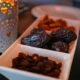 A closeup shot of dates and raisins in a dish for Ramadan.