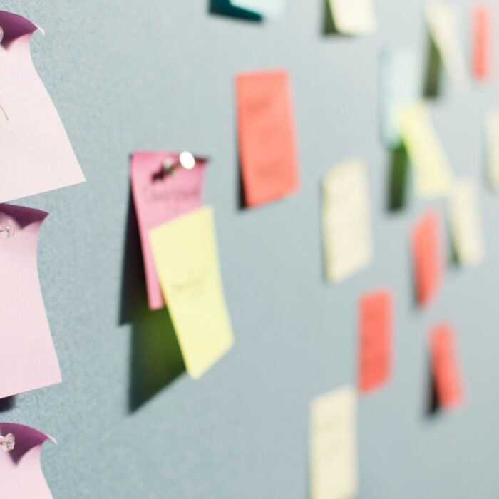 A soft board pinned with sticky notes mapping content strategy.